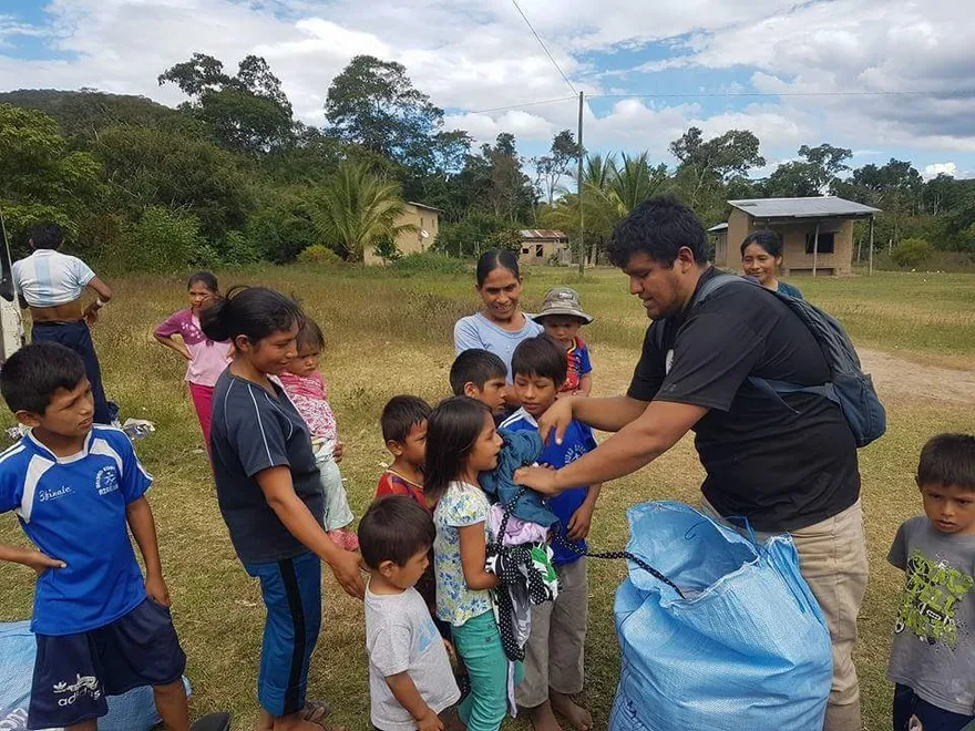 Handing out gifts in a village